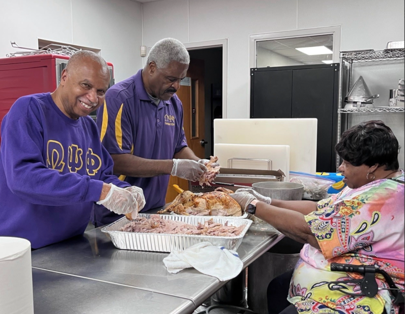 Helping prepare Thanksgiving meals for community members are (l-r) Calvin Jackson and Donald Thomas of Omega Psi Phi, and Bernice Edwards, First State Community Action Agency executive director. SUBMITTED PHOTOS